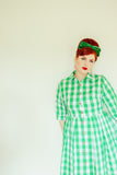 Miss Flossypot wearing Alice green and white gingham shirt dress
